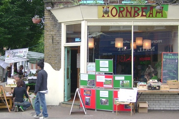 Exterior shopfront with OrganicLea stall to one side